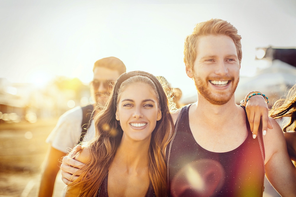 smiling couple with spark clear aligners