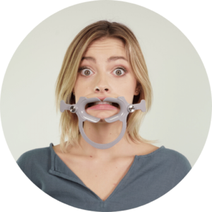 Girl using cheek retractor tool for dental monitoring