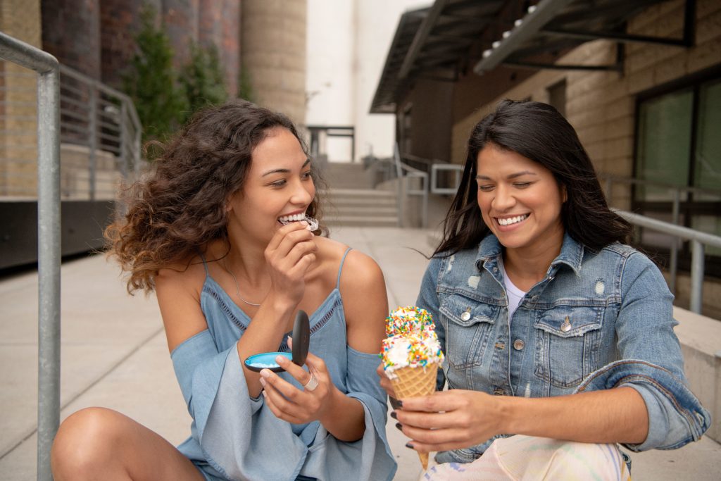 Girls with Invisalign eating ice cream